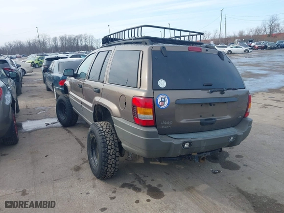 2002 Jeep Grand Cherokee Laredo with VIN 1J4GW48N12C193792, listed as a IAAI auction lot 41545283 with 166,720 mi miles. Bid and sale history available at carsss.com. Image 3.
