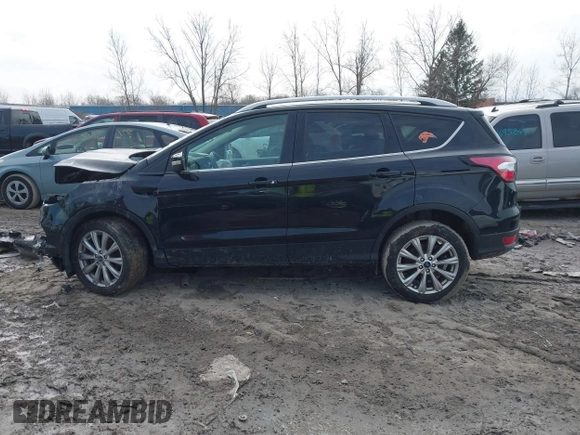 2018 Ford Escape Titanium with VIN 1FMCU0J90JUD17085, listed as a IAAI auction lot 41699687 with Not provided miles and . Bid and sale history available at DreamBid. Image 14.