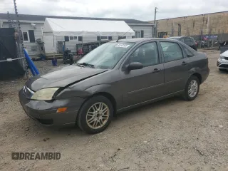 2007 Ford Focus S with VIN 1FAFP34N47W329780, listed as a Copart auction lot 65143155 with 201,985 mi miles and Salvage title. Bid and sale history available at DreamBid. Image 1.