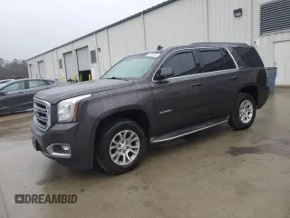 2015 GMC Yukon SLT with VIN 1GKS1BKC9FR278056, listed as a Copart auction lot 44989505 with 205,885 mi miles and Salvage Title. Bid and sale history available at carsss.com. Image 1.