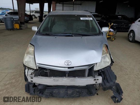 2005 Toyota Prius z VIN JTDKB20U557029770, wystawiony jako Copart lot #59997865 z przebiegiem 237 030 mil mil oraz Szkoda całkowita • Salvage title. Historia ofert i sprzedaży dostępna na DreamBid. Obrazek 5.