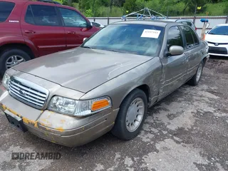 2002 Ford Crown Victoria LX z VIN 2FAFP74W52X112493, wystawiony jako IAAI lot #42197164 z przebiegiem 103 941 mil mil oraz . Historia ofert i sprzedaży dostępna na DreamBid. Obrazek 2.
