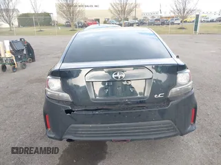 2015 Scion tC with VIN JTKJF5C7XFJ001662, listed as a IAAI auction lot 41843123 with 128,851 mi miles. Bid and sale history available at carsss.com. Image 16.