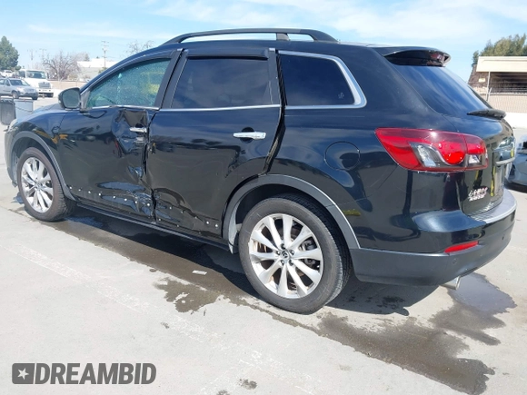 2015 Mazda CX-9 Grand Touring z VIN JM3TB2DA4F0450014, wystawiony jako IAAI lot #41692935 z przebiegiem 90 800 mil mil oraz . Historia ofert i sprzedaży dostępna na DreamBid. Obrazek 3.