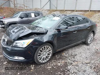 2014 Buick LaCrosse Premium II with VIN 1G4GF5G39EF172201, listed as a IAAI auction lot 41963281 with 106,231 mi miles and . Bid and sale history available at DreamBid. Image 2.