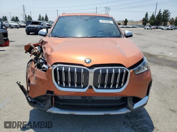 2023 BMW X1 xDrive28i with VIN WBX73EF03P5W54209, listed as a Copart auction lot 64796365 with 19,591 mi miles and Salvage title. Bid and sale history available at DreamBid. Image 5.