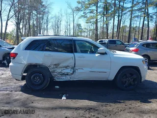 2015 Jeep Grand Cherokee Altitude with VIN 1C4RJFAG4FC924869, listed as a IAAI auction lot 41656444 with 112,786 mi miles. Bid and sale history available at carsss.com. Image 13.