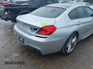 2015 BMW 6 Series 640i z VIN WBA6A0C51FD318982, wystawiony jako IAAI lot #41875547 z przebiegiem 60 968 mil mil oraz . Historia ofert i sprzedaży dostępna na DreamBid. Obrazek 18.