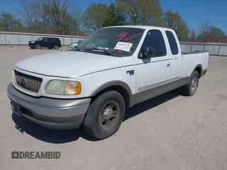 2003 Ford F-150 XL with VIN 1FTRX17L03NA16778, listed as a IAAI auction lot 41602179 with 219,101 mi miles. Bid and sale history available at carsss.com. Image 2.