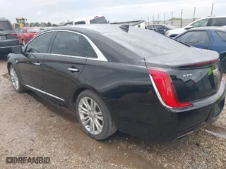 2019 Cadillac XTS Luxury with VIN 2G61M5S32K9141807, listed as a IAAI auction lot 41818444 with 84,864 mi miles. Bid and sale history available at carsss.com. Image 3.