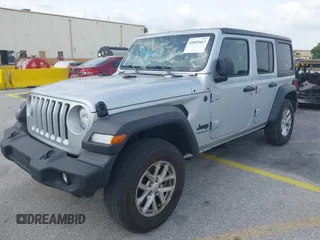 2023 Jeep Wrangler Sport S with VIN 1C4HJXDNXPW702199, listed as a IAAI auction lot 41859413 with 24,942 mi miles and . Bid and sale history available at DreamBid. Image 2.