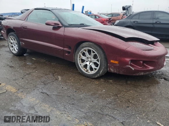 2001 Pontiac Firebird Firebird z VIN 2G2FS22K112122739, wystawiony jako Copart lot #86128074 z przebiegiem 271 969 mil mil oraz Czysty tytuł • Clean title. Historia ofert i sprzedaży dostępna na DreamBid. Obrazek 4.