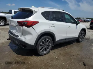 2016 Mazda CX-5 Grand Touring z VIN JM3KE2DYXG0731462, wystawiony jako Copart lot #58220465 z przebiegiem 130 033 mil mil oraz Szkoda całkowita • Salvage title. Historia ofert i sprzedaży dostępna na DreamBid. Obrazek 3.