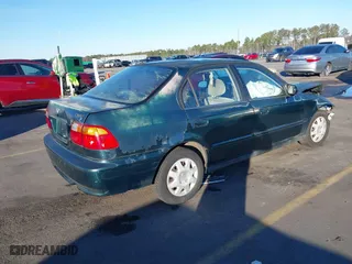 1999 Honda Civic VP with VIN 2HGEJ6614XH564053, listed as a IAAI auction lot 41317610 with 241,757 mi miles. Bid and sale history available at carsss.com. Image 4.