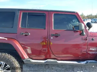 2008 Jeep Wrangler Unlimited Sahara with VIN 1J8GA59198L510502, listed as a IAAI auction lot 41095844 with 161,907 mi miles. Bid and sale history available at carsss.com. Image 13.