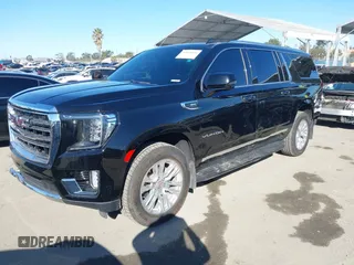 2021 GMC Yukon XL SLT with VIN 1GKS2GKD0MR471504, listed as a IAAI auction lot 41668145 with 55,917 mi miles. Bid and sale history available at carsss.com. Image 2.