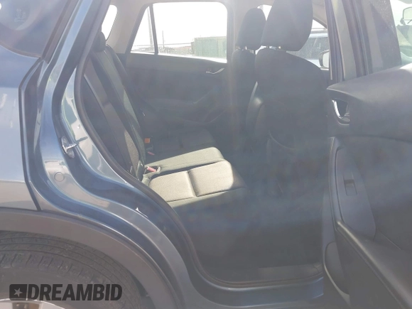 2016 Mazda CX-5 Sport with VIN JM3KE4BY0G0746034, listed as a IAAI auction lot 41842894 with 92,801 mi miles. Bid and sale history available at carsss.com. Image 8.