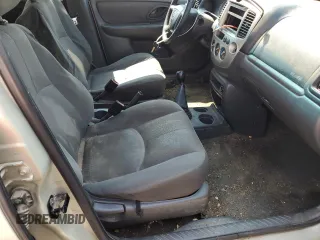 2004 Mazda Tribute DX with VIN 4F2YZ02B74KM13874, listed as a Copart auction lot 65422864 with 288,215 mi miles and Salvage Title. Bid and sale history available at carsss.com. Image 11.