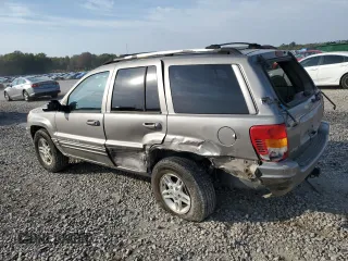 1999 Jeep Grand Cherokee Limited with VIN 1J4G268S7XC668348, listed as a Copart auction lot 77824084 with 165,779 mi miles and Salvage title. Bid and sale history available at DreamBid. Image 2.