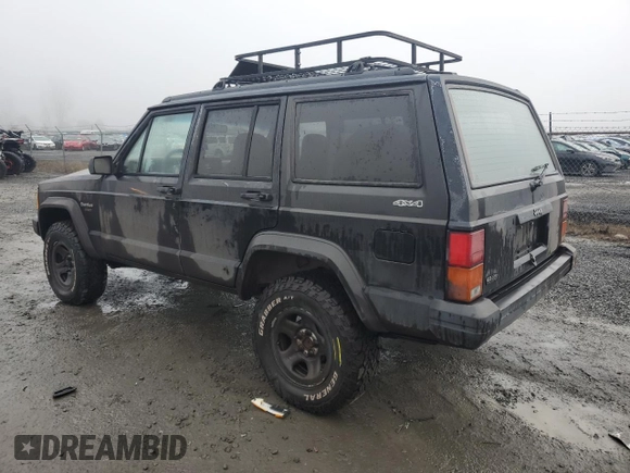 1996 Jeep Cherokee Sport with VIN 1J4FJ68S0TL288244, listed as a Copart auction lot 87801025 with 218,356 mi miles and Salvage Title. Bid and sale history available at carsss.com. Image 2.