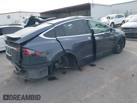 2016 Tesla Model X 70D with VIN 5YJXCAE27GF015175, listed as a IAAI auction lot 41074929 with 115,130 mi miles. Bid and sale history available at carsss.com. Image 4.