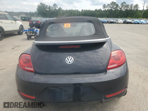 2014 Volkswagen Beetle 1.8T w/Premium z VIN 3VW517AT6EM816698, wystawiony jako Copart lot #57344055 z przebiegiem 52 782 mil mil oraz Szkoda całkowita • Salvage title. Historia ofert i sprzedaży dostępna na DreamBid. Obrazek 6.