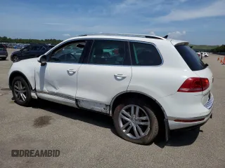 2016 Volkswagen Touareg Sport with VIN WVGEF9BPXGD010830, listed as a Copart auction lot 58663734 with 148,091 mi miles and Salvage Title. Bid and sale history available at DreamBid. Image 2.