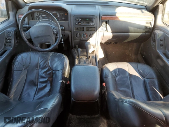 1999 Jeep Grand Cherokee Laredo z VIN 1J4GW58N8XC736438, wystawiony jako Copart lot #88605625 z przebiegiem 181 612 mil mil oraz Czysty tytuł • Clean title. Historia ofert i sprzedaży dostępna na DreamBid. Obrazek 8.