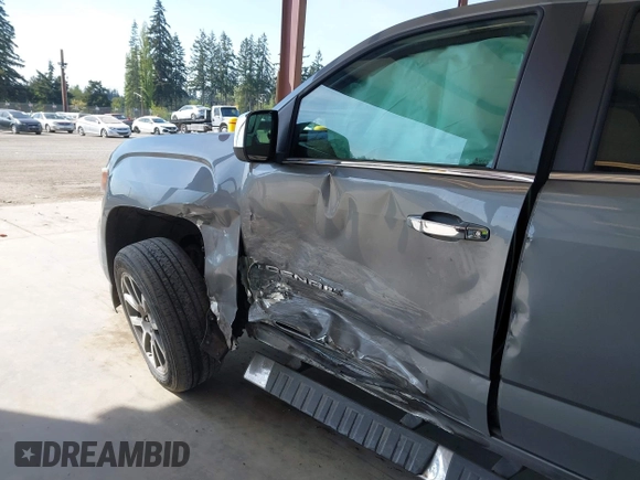 2021 GMC Canyon 4WD Denali with VIN 1GTG6EEN5M1102747, listed as a IAAI auction lot 42121134 with 60,412 mi miles and . Bid and sale history available at DreamBid. Image 6.
