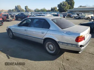 1999 BMW 7 Series 740il with VIN WBAGH833XXDP05142, listed as a Copart auction lot 74104394 with 0 mi miles and Salvage Title. Bid and sale history available at carsss.com. Image 2.