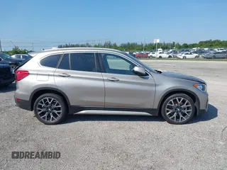 2021 BMW X1 sDrive28i z VIN WBXJG7C09M5U26043, wystawiony jako IAAI lot #36062187 z przebiegiem 14 844 mil mil oraz . Historia ofert i sprzedaży dostępna na DreamBid. Obrazek 13.