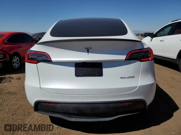 2024 Tesla Model Y Performance with VIN 7SAYGDEF6RA284171, listed as a Copart auction lot 50317205 with 6,870 mi miles and Salvage Title. Bid and sale history available at DreamBid. Image 6.