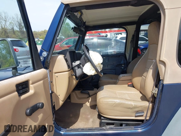2000 Jeep Wrangler Sport with VIN 1J4FA49S5YP750123, listed as a IAAI auction lot 42060009 with Not Provided miles. Bid and sale history available at carsss.com. Image 5.