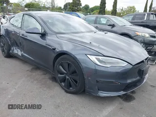 2021 Tesla Model S Long Range with VIN 5YJSA1E57MF441387, listed as a IAAI auction lot 42034307 with Not provided miles and . Bid and sale history available at DreamBid. Image 1.