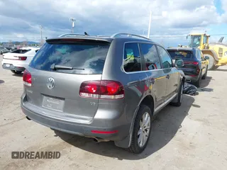 2010 Volkswagen Touareg VR6 with VIN WVGBF7A96AD002466, listed as a IAAI auction lot 41709052 with 204,819 mi miles and . Bid and sale history available at DreamBid. Image 4.