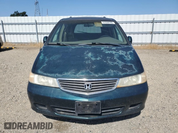 2000 Honda Odyssey EX z VIN 2HKRL1867YH587616, wystawiony jako Copart lot #57258795 z przebiegiem 219 999 mil mil oraz Szkoda całkowita • Salvage title. Historia ofert i sprzedaży dostępna na DreamBid. Obrazek 5.