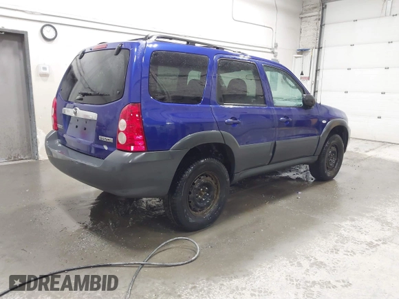 2006 Mazda Tribute i with VIN 4F2YZ92Z16KM37284, listed as a IAAI auction lot 41755952 with 129,284 mi miles and . Bid and sale history available at carsss.com. Image 4.