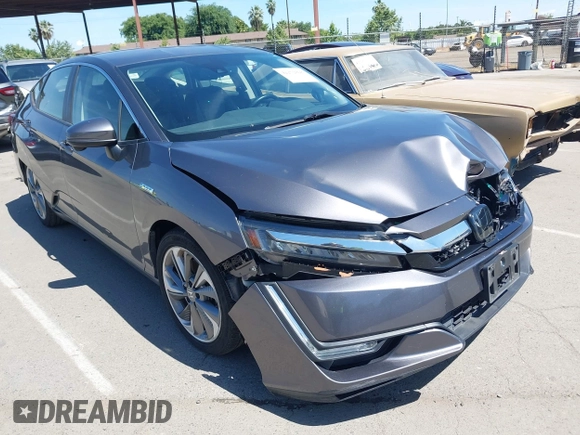 2018 Honda Clarity Touring z VIN JHMZC5F33JC021811, wystawiony jako IAAI lot #42272808 z przebiegiem 82 414 mil mil oraz . Historia ofert i sprzedaży dostępna na DreamBid. Obrazek 1.