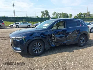 2021 Mazda CX-9 Touring with VIN JM3TCBCY7M0507699, listed as a IAAI auction lot 42603614 with 62,635 mi miles and . Bid and sale history available at DreamBid. Image 14.
