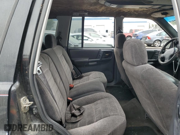 1998 Jeep Grand Cherokee Laredo with VIN 1J4FX58S0WC305329, listed as a Copart auction lot 76777264 with 251,942 mi miles and Clean Title. Bid and sale history available at carsss.com. Image 10.