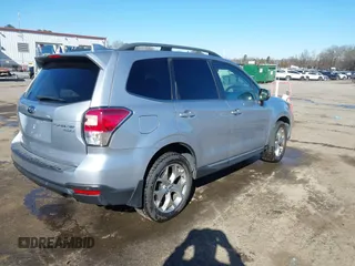 2017 Subaru Forester Touring with VIN JF2SJAWC8HH532348, listed as a IAAI auction lot 41304804 with 104,221 mi miles and . Bid and sale history available at DreamBid. Image 4.