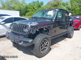 2024 Jeep Wrangler Rubicon with VIN 1C4PJXFG5RW259926, listed as a IAAI auction lot 42009249 with 37,988 mi miles. Bid and sale history available at carsss.com. Image 2.
