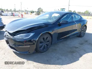 2023 Tesla Model S with VIN 5YJSA1E54PF531021, listed as a IAAI auction lot 42014104 with Not provided miles and . Bid and sale history available at DreamBid. Image 2.