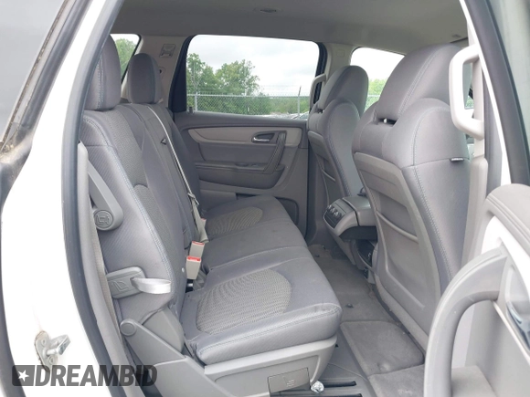 2015 Chevrolet Traverse LS z VIN 1GNKVFED4FJ197970, wystawiony jako IAAI lot #42020771 z przebiegiem 128 876 mil mil oraz . Historia ofert i sprzedaży dostępna na DreamBid. Obrazek 8.