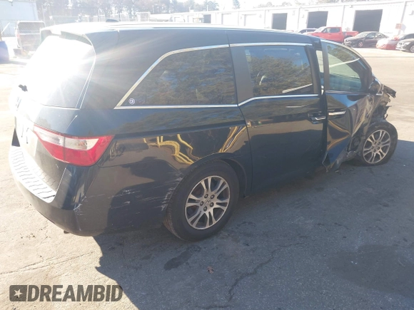 2011 Honda Odyssey EX-L with VIN 5FNRL5H61BB059275, listed as a IAAI auction lot 41293690 with 105,511 mi miles and . Bid and sale history available at carsss.com. Image 4.