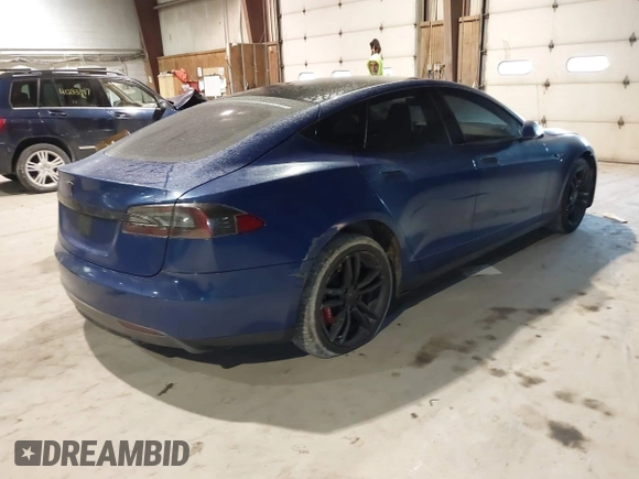 2014 Tesla Model S 60 with VIN 5YJSA1H1XEFP30497, listed as a IAAI auction lot 41294630 with 203,663 mi miles and . Bid and sale history available at DreamBid. Image 4.
