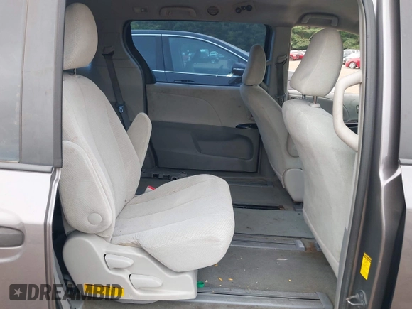 2014 Toyota Sienna L with VIN 5TDZK3DC8ES470837, listed as a IAAI auction lot 42426844 with 302,661 mi miles and . Bid and sale history available at DreamBid. Image 8.