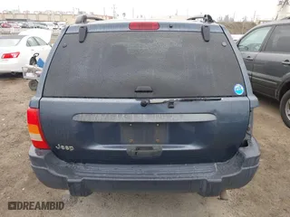 2004 Jeep Grand Cherokee Laredo with VIN 1J4GX48S64C291075, listed as a IAAI auction lot 41805747 with 282,384 mi miles. Bid and sale history available at carsss.com. Image 16.