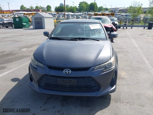 2015 Scion tC with VIN JTKJF5C71FJ013747, listed as a IAAI auction lot 42087740 with 138,097 mi miles. Bid and sale history available at carsss.com. Image 12.