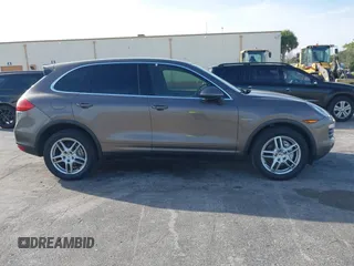 2011 Porsche Cayenne S Hybrid with VIN WP1AE2A29BLA94414, listed as a IAAI auction lot 41644386 with 76,095 mi miles. Bid and sale history available at carsss.com. Image 13.